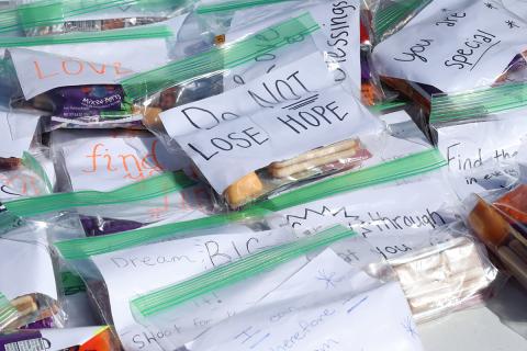 Nursing students put encouraging notes in bags of snacks they distributed at a Giving H.O.P.E. event. 